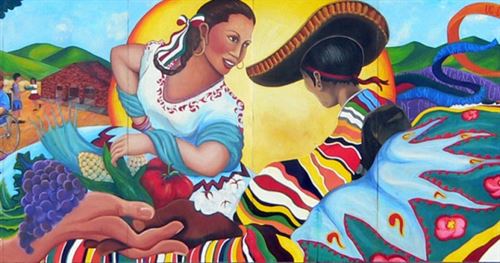 colorful mural with fruit and vegetables offered on a hand to a man and woman with traditional Mexican attire dancing by a sun. 